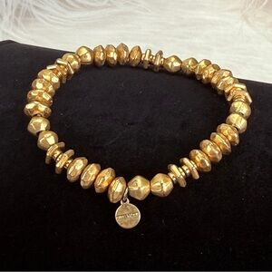 Pretty aged goldtone, weighted Stella & Dot stretch bracelet